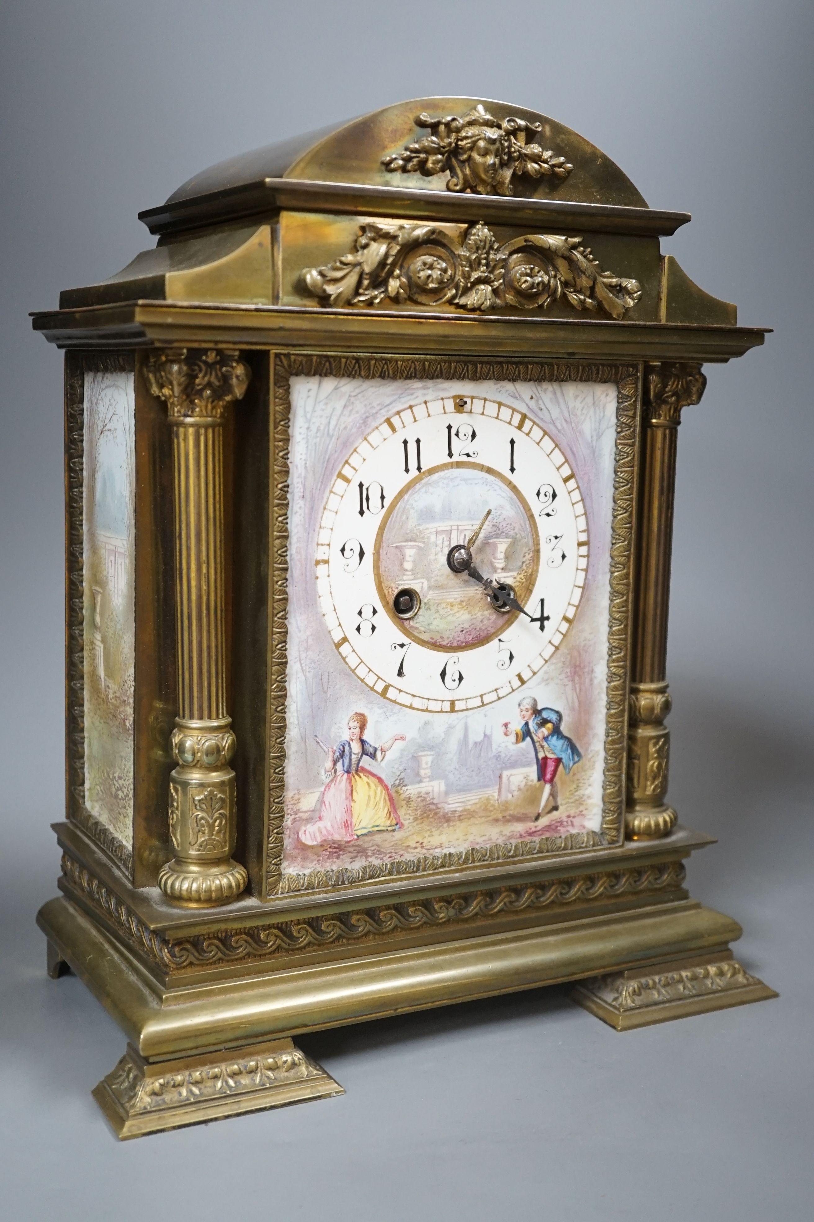 A French porcelain mounted brass mantel clock-31 cms high.